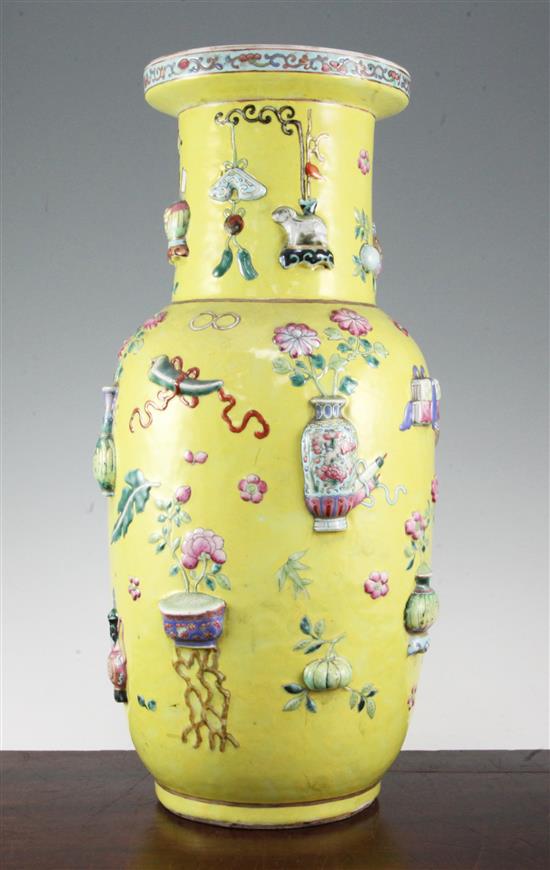 A large Chinese yellow ground and moulded Hundred Antiques vase, 19th century, 44cm